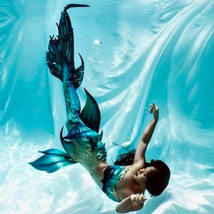 Finfolk Productions Instagram account showing woman underwater wearing mermaid fin" width="300" height="300" srcset="https://blog.hubspot.com/hs-fs/hubfs/fin-folk-productions-instagram-1-1.png?width=150&height=150&name=fin-folk-productions-instagram-1-1.png 150w, https://blog.hubspot.com/hs-fs/hubfs/fin-folk-productions-instagram-1-1.png?width=300&height=300&name=fin-folk-productions-instagram-1-1.png 300w, https://blog.hubspot.com/hs-fs/hubfs/fin-folk-productions-instagram-1-1.png?width=450&height=450&name=fin-folk-productions-instagram-1-1.png 450w, https://blog.hubspot.com/hs-fs/hubfs/fin-folk-productions-instagram-1-1.png?width=600&height=600&name=fin-folk-productions-instagram-1-1.png 600w, https://blog.hubspot.com/hs-fs/hubfs/fin-folk-productions-instagram-1-1.png?width=750&height=750&name=fin-folk-productions-instagram-1-1.png 750w, https://blog.hubspot.com/hs-fs/hubfs/fin-folk-productions-instagram-1-1.png?width=900&height=900&name=fin-folk-productions-instagram-1-1.png 900w" sizes="(max-width: 300px) 100vw, 300px